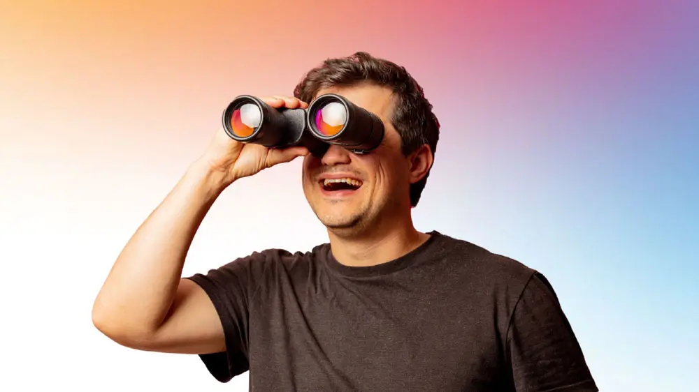 Thumbnail image of a man looking through binoculars